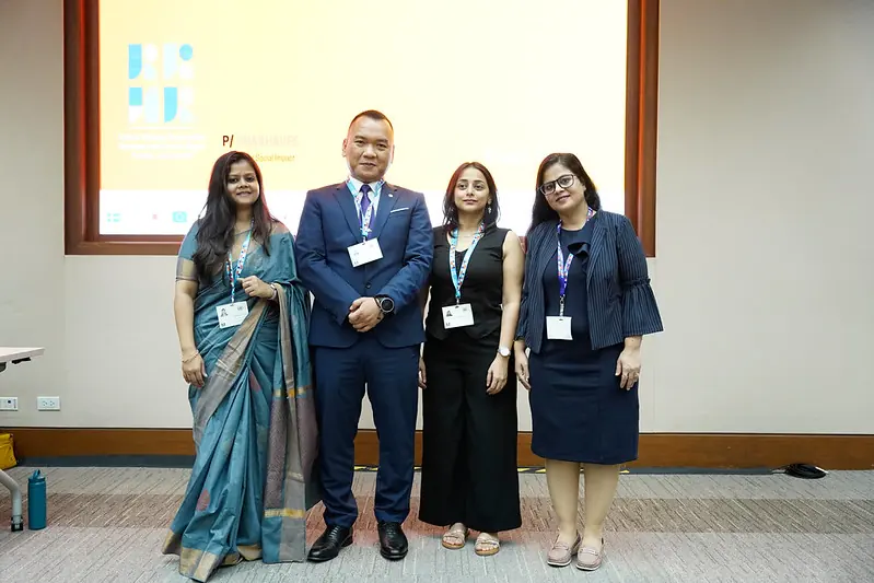 Speakers standing together after a session at the UN Responsible Business and Human Rights Forum